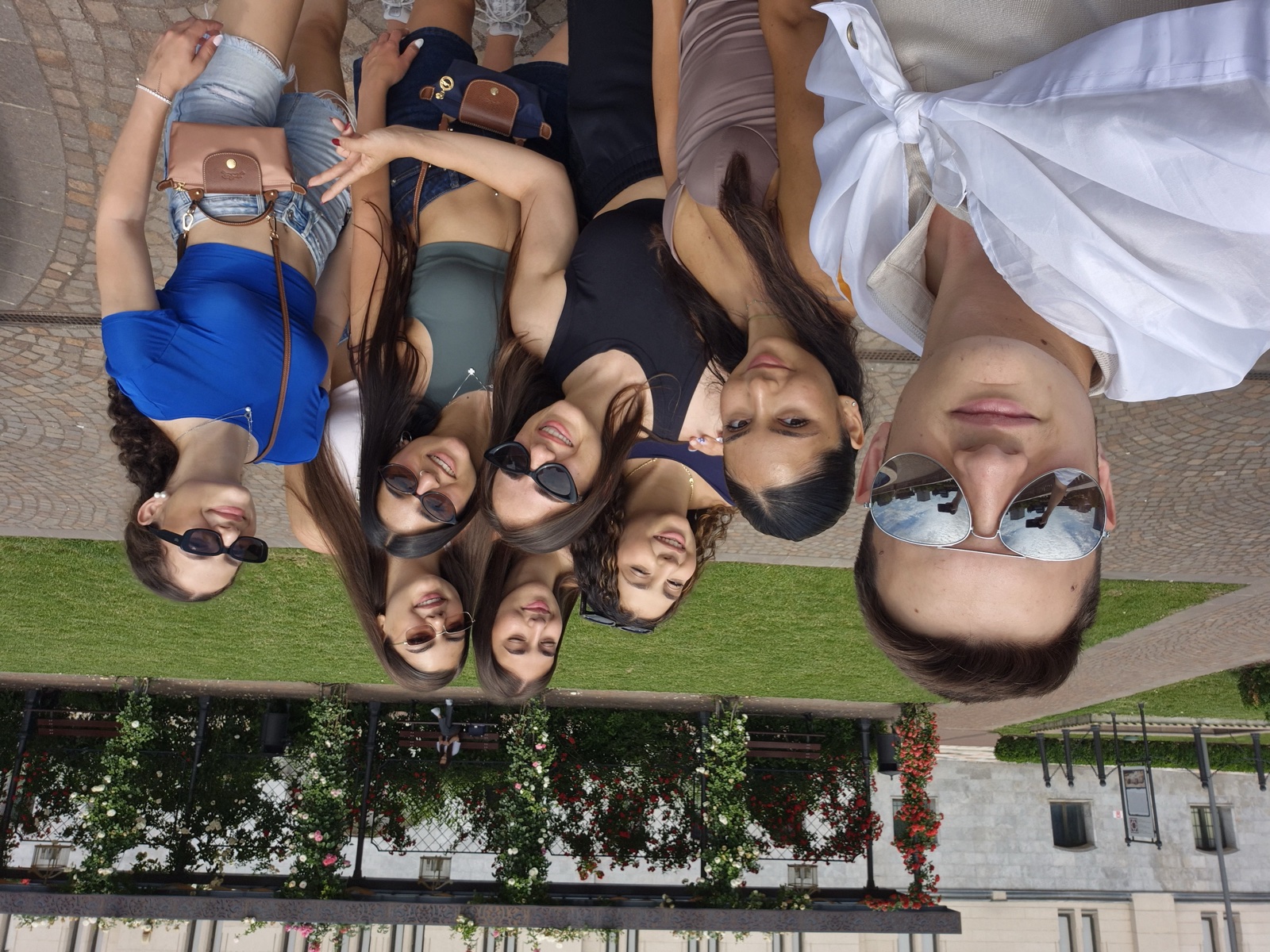 Group selfie in the Palas rose garden in Iași, one participant wearing a flag as a cape