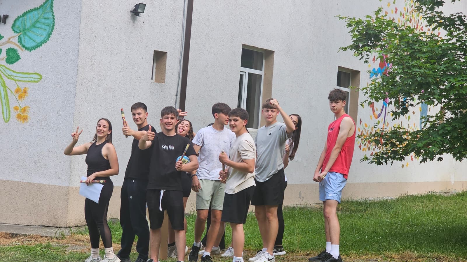 Thumbs up from a kingdom team with their cardboard swords